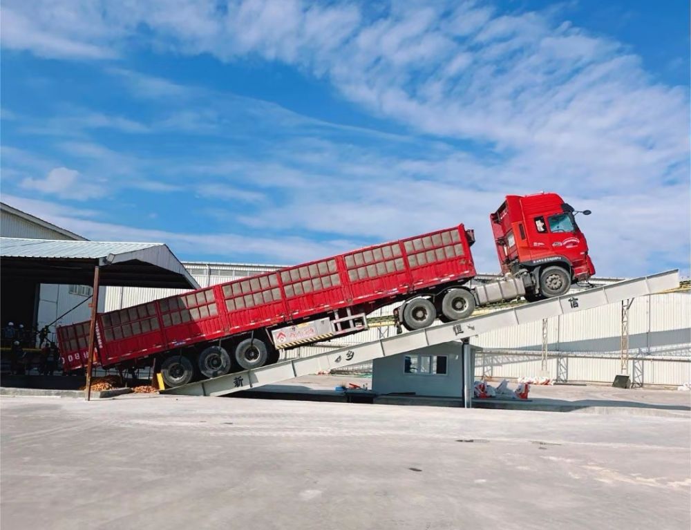 液壓卸車機(jī)、后翻式液壓翻板卸車平臺(tái)、河南愛(ài)信液壓翻板機(jī)